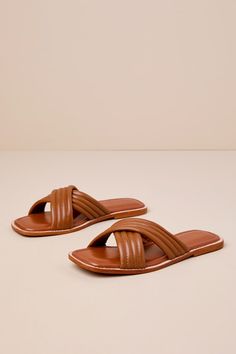 The Rag & Co Eura Tan Leather Slide Sandals will make you more than ready for sunshine and plenty of compliments! Smooth genuine leather shapes these chic sandals that feature a trendy square-toe bed and wide, crisscrossing vamp straps that boast a quilted-like effect. The simple slide-on design makes getting dressed easy and effortlessly cute! Available in whole sizes only. 0. 5" rubber heel. Cushioned insole. Rubber sole has nonskid markings. Genuine leather upper. Balance man made materials. Leather Sandals With Square Toe For Vacation, Trendy Brown Sandals With Square Toe, Trendy Brown Square Toe Sandals, Chic Vacation Sandals With Square Toe, Chic Square Toe Sandals For Vacation, Synthetic Square Toe Sandals For Vacation, Chic Sandals, Leather Slide Sandals, Leather Slides