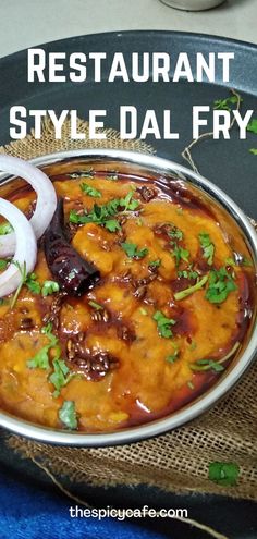 an easy dol fry recipe with onions and cheese in a silver bowl on a blue cloth