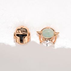 Inspired by the hit Star Wars™ series comes the Star Wars The Mandalorian™ & Grogu™ Studs. This dynamic duo will become your go-to pair. The Mandalorian stud is sleek and showcases his signature armor, while the Grogu stud offers a bright, milky, mint green stone. Star Wars Jewelry, Piercing Inspo, Necklace Chain Lengths, Dynamic Duo, Disney Jewelry, Stud Set, The Mandalorian, Pedro Pascal, Ear Piercing