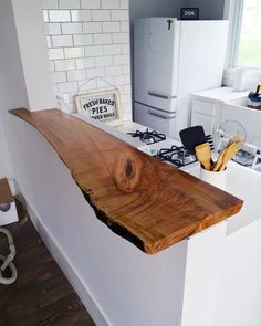 the counter top is made out of wood and has been cut into pieces to make it look