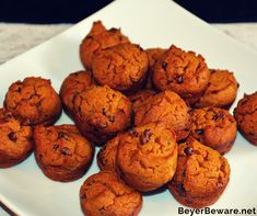 chocolate chip muffins on a white plate ready to be eaten by someone else