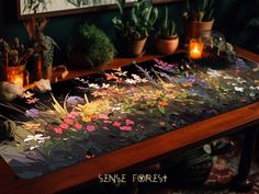 a wooden table topped with lots of plants