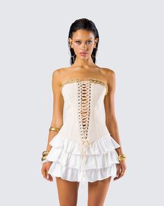 Make them work for it in this lace-up corset top 🤍 Made from canvas fabric and complete with a v-hem and ruffle trim at the front and back neckline - this piece will tie all your looks together 🙌 Summer Bandage Strapless Corset Dress, Summer Strapless Bandage Corset Dress, Fitted Corset Dress With Ruffles For Summer, Fitted Ruffled Corset Dress For Summer, Cream Corset Dress With Ruffles For Party, Fitted Ruffle Corset Dress For Summer, Cream Party Corset Dress With Ruffles, Spring Fitted Bandage Corset Belt, Fitted Bandage Corset Belt For Spring