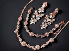 "Your special day deserves the perfect bridal jewelry set to complement your beautiful wedding gown. Whether you prefer the romantic allure of rose gold or the classic elegance of silver, there is a stunning chandelier earrings necklace bracelet waiting for you. Imagine the sparkle and shine of these exquisite pieces as you walk down the aisle, feeling confident and radiant. Plus, don't forget your beloved bridesmaids who also deserve to shine with a matching jewelry set. With exquisite attentio Elegant Rose Gold Jewelry For Mother Of The Bride, Glamorous Rose Gold Jewelry For Wedding, Glamorous Rose Gold Wedding Jewelry, Elegant Rose Gold Bridal Sets For Anniversary, Elegant Rose Gold Bridal Necklace For Party, Hand Set Rose Gold Jewelry Sets For Wedding, Rose Gold Bridal Necklace For Party, Elegant Rose Gold Hand Set Bridal Necklace, Delicate Rose Gold Bridal Necklace For Party