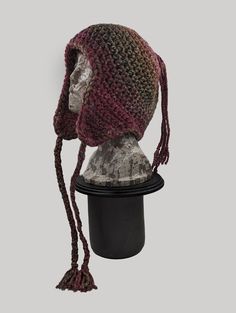 a crocheted hat is on top of a mannequin's head