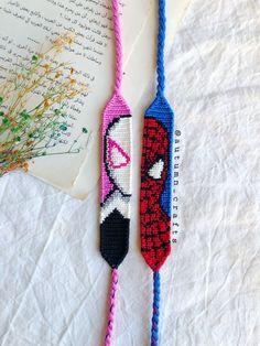 two crocheted bookmarks with spiderman on them