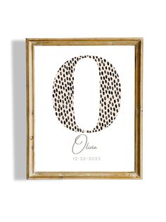 a black and white polka dot print with the letter o in it's center