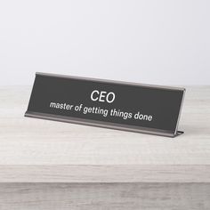 a black and white sign that says,'ceo master of getting things done '