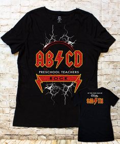 AB/CD PreSchool/Kindergarten/1st Grade Teachers ROCK T-shirt/Raglan Black T-shirt With Heat Transfer Vinyl For School, School Cotton Tops With Band Merch Style, School Tops In Cotton With Band Merch Style, Cotton Band Merch Tops For School, Band Merch Cotton Tops For School, Back To School Black Graphic T-shirt, Black Graphic Print T-shirt For Back To School, School Band Merch Tops With Graphic Print, Band Merch Graphic Print Top For School