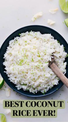 a plate with rice and limes on the side that says best coconut rice ever