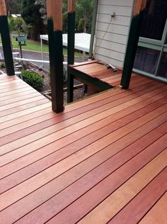 a wooden deck with two benches on it