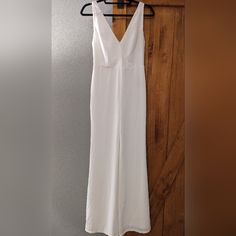 New With Tags Aaka Bridal / Wedding Wide Leg Jumpsuit Size S. Zip Back, Snap Front Closure. Never Worn Lovely Bridal Jumpsuit. I Bought This From Another Posher Hoping To Wear It For My Rehearsal Dinner But It Was Just A Little Too Small For My 30g/35" Bust. Otherwise It Fit Great (I'm 27"Waist X 39" Hips). I'm 5'3" And Would Not Have Had It Hemmed With The 3" Heels I Was Planning To Wear. It's Very Simple And Elegant And You Can Wear A Normal Bra With It. Would Be Great For An Engagement Party, Fitted White V-neck Jumpsuits And Rompers, Summer Wedding V-neck Jumpsuits And Rompers, Elegant White V-neck Jumpsuit, Floor-length Jumpsuits And Rompers For Summer Weddings, Fitted Floor-length Jumpsuits And Rompers For Wedding, White V-neck Jumpsuits And Rompers For Formal Occasions, Fitted V-neck Jumpsuit For Wedding Guests, Fitted White V-neck Jumpsuit, White Fitted V-neck Jumpsuit