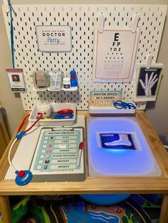 a doctor's office desk with an eye chart on the table and other medical equipment