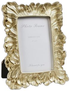 a gold plated photo frame on a white background