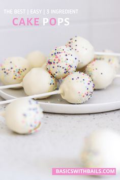 white cake pops with sprinkles on a plate