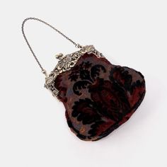 Introducing our captivating collection of Chatelaine purses, inspired by the elegance of the Victorian era.Available in three sizes—Large, Medium, and Small—these purses offer versatility and style. The Large and Medium sizes can be used as both a clutch and a crossbody purse, as we provide two chains for each size: 50" and 13" in length. This allows you to effortlessly switch between crossbody and clutch styles.Let's focus on the Chatelaine Large Crossbody Purse:With a frame width of 6.25" and a height of 8", this purse comfortably holds larger items like the iPhone 14 Pro Max and a passport. It features a small slip pocket for cards or small essentials, and the 1.5" bottom depth provides ample space for your necessities.The Large Crossbody Purse includes two chains, each with brass hooks Elegant Evening Bag For Vintage Events, Vintage Bags With Detachable Handle For Gift, Elegant Clutch Bag For Vintage Events, Antique Satchel For Formal Occasions, Antique Formal Satchel Bag, Antique Style Formal Satchel Bag, Elegant Handmade Satchel Evening Bag, Handmade Elegant Bags For Vintage Events, Victorian Evening Clutch Bag