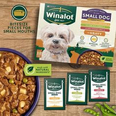 a bowl of dog food next to three packages of small dogs treats on a wooden table