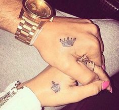 two people with matching tattoos on their hands