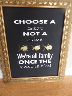 a framed sign that says choose a seat not a side we're all family once the knot is tied