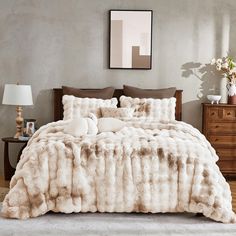 a bedroom with a large bed covered in fur