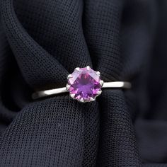 Product Details Enhance your appearance with the exquisite Solitaire Ring. Its elegant design features a mesmerizing Round Cut Amethyst, delicately set in a Lotus Basket Setting. This enchanting ring is the perfect accessory to elevate your style, making it an exceptional choice for any special occasion. Product Information SKU SHP-RINGS121911482 Width 5 mm Height 6.5 mm Weight 2.16 gm (Approximate) AMETHYST INFORMATION No.of Stones 1 Pieces Total Weight 1.20 Carat (Approximate) Dimension(approx) Round-7X7 mm-1 Pcs Color Voilet Cut Brilliant Shape Round Setting Type Lotus-Basket-Setting Quality Grade AAA View More Product Parent Collection Handle amethyst-rings Basket Setting, 18k Yellow Gold Ring, Ring Sizer, Amethyst Ring, Elevate Your Style, Yellow Gold Rings, Solitaire Ring, Round Cut, Elegant Design