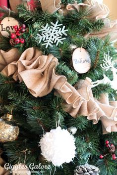 a christmas tree decorated with burlocks and ornaments