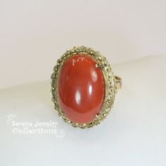 Vivid oxblood red Sardinia Coral Ring set in 14k yellow gold! Ring Size: 6.25 Total Weight: 8.45 grams Precious Metal: 14k solid gold Precious stones: -Coral Center Stone: 22.1mm x 15.5mm, 14.5carats Hallmark: 14k, TAIWAN Red Oval Cabochon Jewelry With Polished Finish, Elegant Red Cabochon Gemstones, 14k Gold Red Cabochon Ring, 14k Gold Cabochon Red Ring, Red Ruby Oval Cabochon Ring In 14k Gold, Oval Cabochon Red Ruby Ring In 14k Gold, 14k Gold Rings With Red Cabochon, Formal Carnelian Oval Cabochon Jewelry, Formal Oval Cabochon Carnelian Jewelry