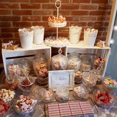 a table topped with lots of desserts and sweets