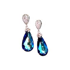 White gold plated metal bail with cubic zirconia deco and swarovski teardrop bermuda blue pendant crystal Large Swarovski 6100 Bermuda Blue precision faceted crystal teardrops  The Swarovski crystals measure 24 mm (1 inch) Tthe whole earrings including the Sterling Silver Ear post about 1.5 " (37mm) in total length This beautiful pair of Earrings is packaged in a gift box. Formal Teardrop Crystal Clip-on Earrings, Teardrop Crystal Clip-on Earrings For Formal Occasions, Formal Teardrop Crystal Earrings With Sparkling Stones, Gift Teardrop Earrings With Diamond Accents, Sparkling Teardrop Earrings As A Gift, Teardrop Pendant Earrings With Sparkling Stones For Gift, Teardrop Crystal Earrings With Diamond Accents Gift, Formal Crystal Pear-shaped Teardrop Earrings, Formal Crystal Teardrop Earrings