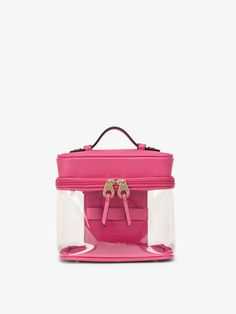 a pink suitcase with two handles on top