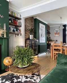 a living room filled with furniture and a fire place