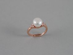 This beautiful CZ pearl ring features a 8-8.5 AAA genuine fresh water white pearl with high quality Rose gold plated triple cubic zirconia setting (nickel and lead free). These are tarnish resistant. Also available in White gold (silver colored) and gold band finish. Great gifts for weddings, moms, birthday and holidays. Size is 7 US and can be stretched a little bit to fit larger finger size. Other pearl colors (peach, lavender pink, and peacock black) are also available. If you are interested Formal Rose Gold Pearl Ring, Elegant Rose Gold Pearl Ring As A Gift, Elegant Rose Gold Pearl Ring Gift, Pearl White Rings With Pearl Charm For Anniversary, Pearl White Open Ring For Anniversary, Pearl Open Ring For Wedding, Open Pearl Ring For Wedding, Anniversary Pearl White Rings With Pearl Charm, White Open Ring Pearl Ring For Wedding