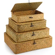 three wicker boxes stacked on top of each other