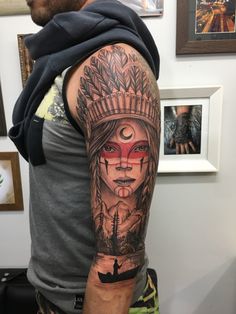 a man with a native american tattoo on his arm