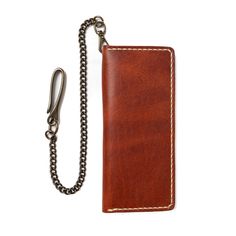 A Leather Long Wallet for those who carry a lot.This wallet was designed to carry unfolded bills, a lot of cards, and even your checkbook. For those of us who like the minimalist approach, but refuse to downsize the cards we carry. Featuring an optional lever snap chain so you can always have the Long Wallet by your side.Our full-grain leather means your wallet will develop character and patina. We hand-sew this wallet with thick Tiger Thread so it will never unravel or come apart. The wallet fe Luxury Textured Leather Rectangular Wallet, Luxury Leather Wallet On Chain With Gold-tone Hardware, Trucker Wallet, Tan Leather Wallet, Rectangular, Brown Vegetable-tanned Leather Wallets For Everyday Use, Leather Wallet With Chain, Rectangular, Biker Wallet, Horween Leather, Leather Company