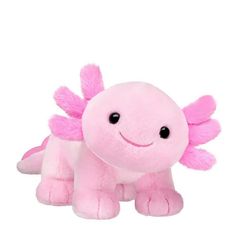 a pink stuffed animal with large wings on it's back and eyes, sitting in front of a white background