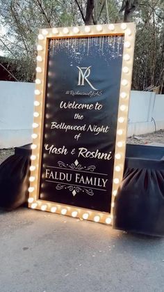 a sign with lights on it that says welcome to the bedtime night and hash & roshi fadu family