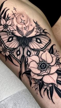 a black and white butterfly with flowers on it's thigh, next to the word hystgramm