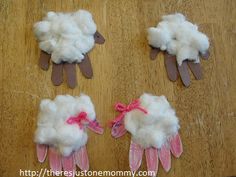 four pairs of gloves made to look like sheep