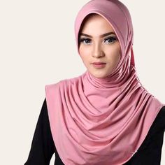 "Zhaviah Jersey Hijab is a simple instant hijab that can be use for everyday FABRIC & CARE This khimar is all handmade using 100% jersey fabric. Jersey is a soft stretchy. The fabric is usually light-to-medium weight. To maintain Zhaviah Khimar, turn inside out and machine wash using cold water on a gentle cycle, keeping dark colors separate. Do not bleach, tumble dry on low, and use a steamer if needed. SIZE & FIT Zhaviah Khimar are one-size-fits-all -Front drapped:  24.2 inch (61,5 cm) -Back drapped: 21.2 inch (54 cm) *Please allow 1-3 cm of error due to manual measurement                         SHIPPING TIME: -Zhaviah hijab are usually made to order. Please allow 5-7 days for production time before your hijab is ready for sending. We will try as fast as we could to fulfill your orders. Modest Pink Headscarf For Eid, Shawl For Women, Hijab Designs, Jersey Hijab, Instant Hijab, Trending Today, Shawls And Wraps, Dark Colors, Head Wraps