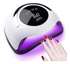 a woman's hand with red nail polish next to a white and purple manicure machine