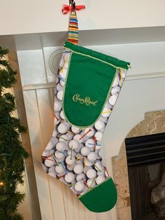 a stocking filled with golf balls hanging from a fireplace