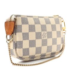 This is an authentic LOUIS VUITTON Damier Azur Mini Pochette Accessories. This stylish small pochette is crafted of Louis Vuitton signature checkerboard coated canvas in blue and white. The bag features a polished gold-toned wristlet strap and a top zipper that opens to an ivory fabric interior. Mini Pochette Accessories, Favorite Mm, Pochette Accessories, Louis Vuitton Clutch, Louis Vuitton Empreinte, Ivory Fabric, Louis Vuitton Damier Azur, Louis Vuitton Pochette, Lv Monogram