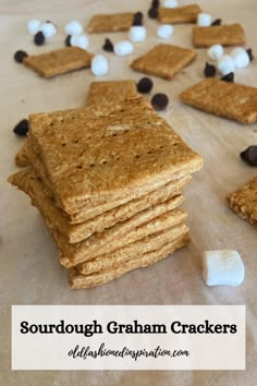 homemade graham crackers with marshmallows and chocolate chips on top, ready to be eaten