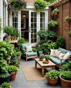 an outdoor patio with potted plants and furniture