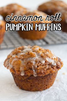 cinnamon roll pumpkin muffins on a cooling rack with the words cinnamon roll pumpkin muffins