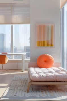 a living room filled with furniture next to tall windows and a table in front of it