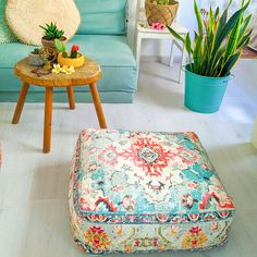 a living room filled with furniture and plants