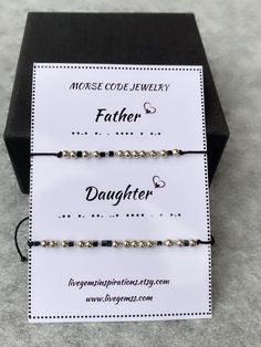 two bracelets that say, father and daughter