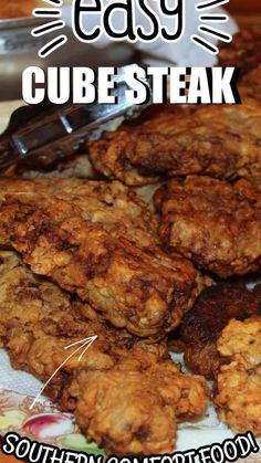 some fried food is on a plate with a fork and the words easy cube steak